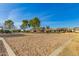 Community sand volleyball court, playground, and nearby houses offer outdoor recreational activities at 16510 W Tether Trl, Surprise, AZ 85387