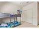 bedroom featuring a bunkbed, carpet, and closet with sliding doors at 18658 N Desert Willow Dr, Maricopa, AZ 85138