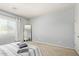 Bright bedroom with neutral color palette, carpeted floors, and large mirror creates an open feel at 18658 N Desert Willow Dr, Maricopa, AZ 85138