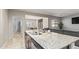 Open kitchen area with a granite island that enhances entertaining and leads to living spaces at 18658 N Desert Willow Dr, Maricopa, AZ 85138