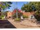 Secluded backyard oasis with lush landscaping, cozy seating areas, and a tranquil water feature at 18813 N 37Th Pl, Phoenix, AZ 85050