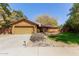 Charming home featuring a well-manicured lawn and inviting curb appeal with a beautiful desert-style front yard at 18813 N 37Th Pl, Phoenix, AZ 85050