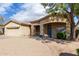 Attractive single-story home with a tile roof, covered entryway, and desert landscaping at 21192 E Stirrup St, Queen Creek, AZ 85142