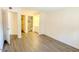 Bright bedroom featuring wood-look floors, ensuite bathroom, and a walk-in closet at 2121 W Union Hills Dr # 104, Phoenix, AZ 85027