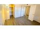 Inviting bedroom with laminate floors, a bright window, and closet access, perfect for relaxation at 2121 W Union Hills Dr # 104, Phoenix, AZ 85027