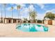 Community pool with lounge seating and covered ramada with tables at 2121 W Union Hills Dr # 104, Phoenix, AZ 85027