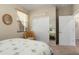 Bedroom with a rattan chair and a large closet, offering style and storage solutions at 21867 N 263Rd Dr, Buckeye, AZ 85396
