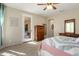 Bedroom featuring neutral carpet, and a glass paneled door leading to the patio at 21867 N 263Rd Dr, Buckeye, AZ 85396