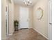 Welcoming entryway featuring neutral walls, tile flooring, and a stylish mirror at 21867 N 263Rd Dr, Buckeye, AZ 85396