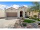 Charming single-story home featuring a desert landscaped front yard and a two-car garage at 21867 N 263Rd Dr, Buckeye, AZ 85396