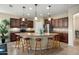 Bright kitchen with a large island, modern appliances, and stylish pendant lighting at 21867 N 263Rd Dr, Buckeye, AZ 85396