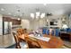 Open concept living area with dining, kitchen, and living rooms for easy entertaining and comfort at 21867 N 263Rd Dr, Buckeye, AZ 85396