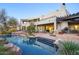 Expansive outdoor living space with a beautiful pool, patio, and desert landscaping at 22500 N 97Th St, Scottsdale, AZ 85255