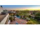 Charming backyard with a pool, verdant landscaping, a patio with pavers, and festive string lights at 22500 N 97Th St, Scottsdale, AZ 85255