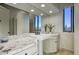 This bathroom features a pedestal sink with granite counters, and a window with a desert view at 22500 N 97Th St, Scottsdale, AZ 85255