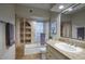 Updated bathroom features a tiled shower with glass door, and granite countertops at 22500 N 97Th St, Scottsdale, AZ 85255