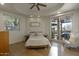 Tranquil bedroom featuring hardwood floors, a neutral color palette, and sliding doors to the outside patio at 22500 N 97Th St, Scottsdale, AZ 85255