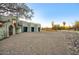 A modern house with a three car garage and desert landscaping at 22500 N 97Th St, Scottsdale, AZ 85255
