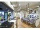 Open concept kitchen featuring marble counters, breakfast bar, and seamless flow to outdoor living at 22500 N 97Th St, Scottsdale, AZ 85255