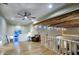 Cozy loft area featuring exposed beams, hardwood floors, and a comfortable sitting area at 22500 N 97Th St, Scottsdale, AZ 85255