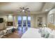 Spacious main bedroom suite with a fireplace, lounge chairs, and beautiful outdoor views at 22500 N 97Th St, Scottsdale, AZ 85255