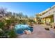 Stunning backyard featuring a lagoon style pool, lush landscaping, and hillside views at 22500 N 97Th St, Scottsdale, AZ 85255