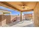 Inviting covered back patio with fan, alongside a shaded hot tub area at 23649 W Watkins St, Buckeye, AZ 85326