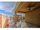 Comfortable covered back patio leading to a well-maintained hot tub area at 23649 W Watkins St, Buckeye, AZ 85326