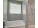 Bright bathroom showcasing a soaking tub, shower, and window with blinds at 23649 W Watkins St, Buckeye, AZ 85326