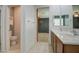 Bathroom featuring double sinks, tile flooring, and access to the toilet room at 23649 W Watkins St, Buckeye, AZ 85326