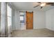 Bedroom with ceiling fan and a barn door leading to the bathroom at 23649 W Watkins St, Buckeye, AZ 85326
