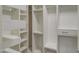 Custom closet with multiple shelves, drawers, and hanging space for organized storage at 23649 W Watkins St, Buckeye, AZ 85326