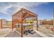 Outdoor hot tub covered by a lattice pergola and surrounded by gravel at 23649 W Watkins St, Buckeye, AZ 85326