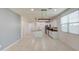 Open-concept kitchen with an island, modern lighting, and stainless-steel appliances at 23649 W Watkins St, Buckeye, AZ 85326