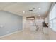 Open-concept kitchen with an island, modern lighting, and stainless-steel appliances at 23649 W Watkins St, Buckeye, AZ 85326