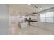 Bright kitchen with a central island, modern lighting, and stainless steel appliances at 23649 W Watkins St, Buckeye, AZ 85326