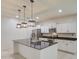 Bright kitchen with a central island, modern lighting, and stainless-steel appliances at 23649 W Watkins St, Buckeye, AZ 85326