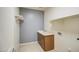 Functional laundry room with a sink, cabinet storage, and utility connections at 23649 W Watkins St, Buckeye, AZ 85326