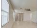 Bright living room featuring tile floors, neutral walls and large windows with coverings at 23649 W Watkins St, Buckeye, AZ 85326