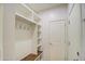 Functional mudroom with built-in storage shelves, hooks, and a wooden bench at 23649 W Watkins St, Buckeye, AZ 85326