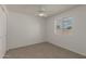 Neutral bedroom with carpet, ceiling fan, and a bright window at 2512 W Knowles Ave, Mesa, AZ 85202