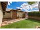 Exterior shot of home, showcasing the backyard and entry gate at 2512 W Knowles Ave, Mesa, AZ 85202