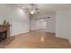 Empty living room with hardwood floors and a brick fireplace at 2512 W Knowles Ave, Mesa, AZ 85202