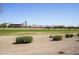 Expansive backyard offering scenic views of the golf course and distant mountain range at 2663 S Springwood Blvd # 326, Mesa, AZ 85209