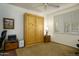 Bedroom features a Murphy bed, shuttered window, and a neutral color scheme at 2663 S Springwood Blvd # 326, Mesa, AZ 85209
