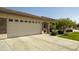 Well-maintained home showcasing a three-car garage, tidy landscaping, and a serene, welcoming atmosphere at 2663 S Springwood Blvd # 326, Mesa, AZ 85209
