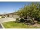 Attractive home with a three-car garage, lovely landscaping, and a cozy front sitting area at 2663 S Springwood Blvd # 326, Mesa, AZ 85209