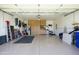 Spacious three-car garage featuring ample storage cabinets and built-in organization systems at 2663 S Springwood Blvd # 326, Mesa, AZ 85209
