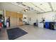 Organized three-car garage offering extensive storage, a well-lit interior, and functional space at 2663 S Springwood Blvd # 326, Mesa, AZ 85209