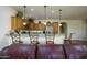 Kitchen bar with granite countertops, pendant lighting, and seating at 2663 S Springwood Blvd # 326, Mesa, AZ 85209